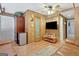Wood paneled living room with leather sofas, mini fridge, and door at 2510 Shoreline Pkwy, Villa Rica, GA 30180