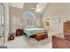 Relaxing main bedroom featuring a vaulted ceiling, large window, and access to the main bathroom at 2510 Shoreline Pkwy, Villa Rica, GA 30180