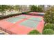Well-maintained tennis courts for recreational play, surrounded by lush landscaping and trees at 2510 Shoreline Pkwy, Villa Rica, GA 30180