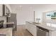 Modern kitchen boasts stainless steel appliances, granite counters, and an open layout for cooking and entertaining at 982 Sutherland Ln # 30, Lawrenceville, GA 30043