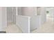 Hallway features white walls, carpeted floors, and offers access to bedrooms, bathrooms and storage at 982 Sutherland Ln # 30, Lawrenceville, GA 30043