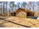 Rustic home with wood and stone exterior and mature trees for added privacy at 166 Muse Rd, Fayetteville, GA 30214