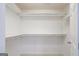 Walk-in closet features built-in shelving and ample storage for clothing and accessories at 1067 Pinehurst Dr, Peachtree City, GA 30269