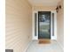Inviting front porch with stylish door and 'Hello' welcome mat at 1067 Pinehurst Dr, Peachtree City, GA 30269