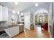 Bright kitchen with stainless steel appliances, a vaulted ceiling, and a view to an adjacent living space at 1067 Pinehurst Dr, Peachtree City, GA 30269