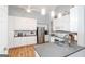 Modern kitchen featuring stainless steel appliances, granite countertops, and white cabinetry at 1067 Pinehurst Dr, Peachtree City, GA 30269