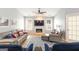 Bright living room featuring stylish furniture, hardwood floors, and modern fireplace at 1067 Pinehurst Dr, Peachtree City, GA 30269