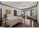 Bedroom with neutral walls, ceiling fan, and ample natural light from the windows at 1561 Aiken Chafin Ln, Mcdonough, GA 30252