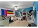 Cozy bedroom featuring neutral carpet floors and a unique rainbow flag at 1561 Aiken Chafin Ln, Mcdonough, GA 30252