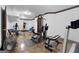 Home gym featuring workout equipment, punching bag, and weights at 1561 Aiken Chafin Ln, Mcdonough, GA 30252