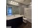 Bathroom featuring a combination tub and shower, a large vanity, and wood-look flooring at 1463 River Stone Trce, Conyers, GA 30012