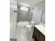 Contemporary bathroom features a shower-over-tub, updated fixtures, and modern design at 299 Lagrange St, Grantville, GA 30220