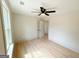 Bright bedroom featuring modern ceiling fan, wood floors, and natural light at 299 Lagrange St, Grantville, GA 30220