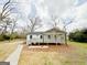 Charming single-story home showcasing a spacious deck and inviting front yard at 299 Lagrange St, Grantville, GA 30220