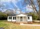 Charming renovated single-story home with a welcoming front porch and a well-manicured lawn at 299 Lagrange St, Grantville, GA 30220