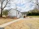 Inviting single-story home featuring a covered porch, sidewalk and fresh landscaping at 299 Lagrange St, Grantville, GA 30220