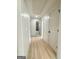 Bright hallway with hardwood floors leads to multiple rooms at 299 Lagrange St, Grantville, GA 30220