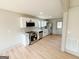 Modern kitchen boasts stainless steel appliances, white cabinets, and a sleek countertop, perfect for cooking at 299 Lagrange St, Grantville, GA 30220