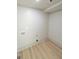 A simple laundry room with connections for a washer and dryer at 299 Lagrange St, Grantville, GA 30220