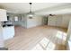 Stylish open floor plan showcases hardwood floors and neutral paint tones, connecting living spaces at 299 Lagrange St, Grantville, GA 30220