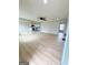 Spacious open-concept living room flows into the modern kitchen, creating an inviting and connected living space at 299 Lagrange St, Grantville, GA 30220