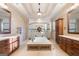 Luxurious bathroom with a soaking tub, walk-in shower, double vanities, and linen storage at 4233 Sandstone Shores Dr, Stonecrest, GA 30038