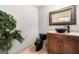 Stylish powder room with a vessel sink, dark fixtures, and a decorative plant at 4233 Sandstone Shores Dr, Stonecrest, GA 30038