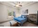 Serene bedroom with a rustic wood bedframe, large window, and cozy decor creating a peaceful and relaxing retreat at 4233 Sandstone Shores Dr, Stonecrest, GA 30038