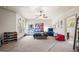 Spacious bedroom with carpet, ceiling fan, and bright windows at 4233 Sandstone Shores Dr, Stonecrest, GA 30038