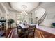 Dining area showcases hardwood floors, custom molding, and adjacent grand staircase at 4233 Sandstone Shores Dr, Stonecrest, GA 30038