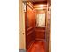 Interior of the elevator with wood paneling and a mirror at the back at 4233 Sandstone Shores Dr, Stonecrest, GA 30038