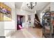 Grand foyer with marble flooring, decorative staircase, and elaborate chandelier creating a welcoming and opulent entrance at 4233 Sandstone Shores Dr, Stonecrest, GA 30038