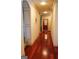 Long hallway with hardwood floors, decorative molding and an elevator at the end at 4233 Sandstone Shores Dr, Stonecrest, GA 30038