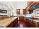 Gourmet kitchen with granite counters, custom cabinets, and stainless steel appliances at 4233 Sandstone Shores Dr, Stonecrest, GA 30038