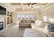 Comfortable living room featuring a fireplace, built-in shelving, and a large sectional sofa at 4233 Sandstone Shores Dr, Stonecrest, GA 30038