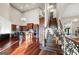 Open floor plan showcases the kitchen, living area, and staircase with custom railing at 4233 Sandstone Shores Dr, Stonecrest, GA 30038