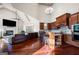 Open-concept kitchen and living area with vaulted ceilings and a cozy fireplace at 4233 Sandstone Shores Dr, Stonecrest, GA 30038