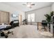 Bright home office with a ceiling fan, large window, and ample desk space at 4233 Sandstone Shores Dr, Stonecrest, GA 30038