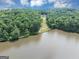 Expansive pond view, backing to a home nestled among the trees at 4233 Sandstone Shores Dr, Stonecrest, GA 30038