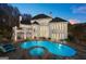 Backyard pool with jacuzzi and ample seating space for ultimate relaxation and entertaining at 4233 Sandstone Shores Dr, Stonecrest, GA 30038