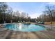 Inviting in-ground pool with a spa, surrounded by lounge chairs at 4233 Sandstone Shores Dr, Stonecrest, GA 30038