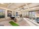 Spacious recreation room featuring a pool table, ample seating, and natural light, perfect for entertainment and relaxation at 4233 Sandstone Shores Dr, Stonecrest, GA 30038