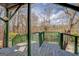 Backyard deck with a view of the woods and lake, providing an outdoor retreat at 650 Malcom Rd, Covington, GA 30014