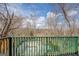 Green fenced backyard area with a view of the lake, offering scenic outdoor space at 650 Malcom Rd, Covington, GA 30014