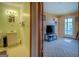 A partial view of a bathroom adjacent to living room, showcasing the functional layout at 650 Malcom Rd, Covington, GA 30014