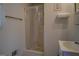 Simple bathroom includes a shower, towel rack, and corner sink at 650 Malcom Rd, Covington, GA 30014