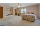 Spacious bedroom features natural light, fan, and a neutral color scheme creating a serene and inviting atmosphere at 650 Malcom Rd, Covington, GA 30014