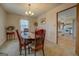 Traditional dining room with wood furniture and adjacent view into the kitchen area at 650 Malcom Rd, Covington, GA 30014