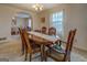 Traditional dining room with wood table, chairs, and chandelier in a cozy home setting at 650 Malcom Rd, Covington, GA 30014