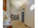 Well-lit entryway featuring a gray front door and unique octagonal windows at 650 Malcom Rd, Covington, GA 30014